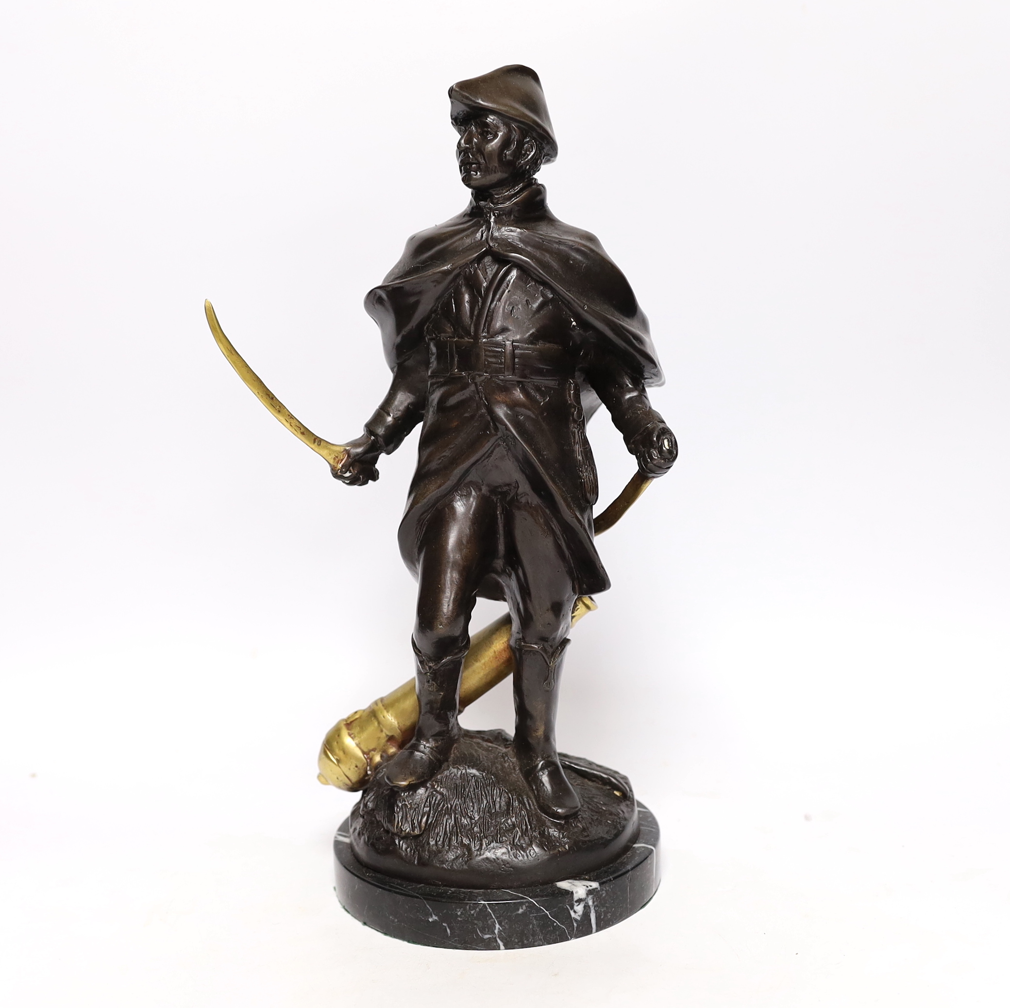 A bronze figure of Wellington with brass sword blade and cannon, signed ‘Boucher’, mounted on a marble base, 34cm